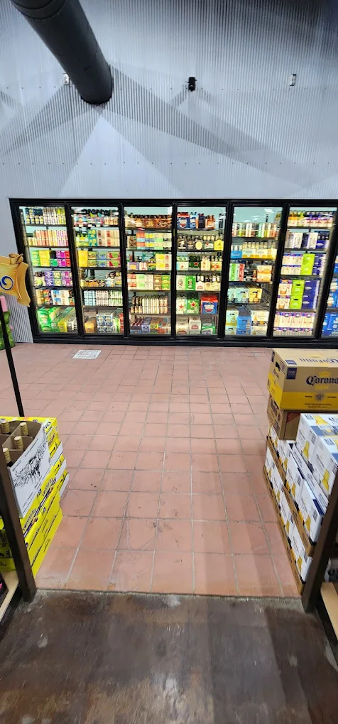Cold beer coolers at Trenton Liquors, stocked for game day