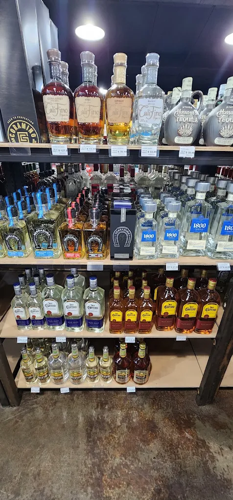 Tequila shelf at Trenton Liquors, stocked for summer cookouts