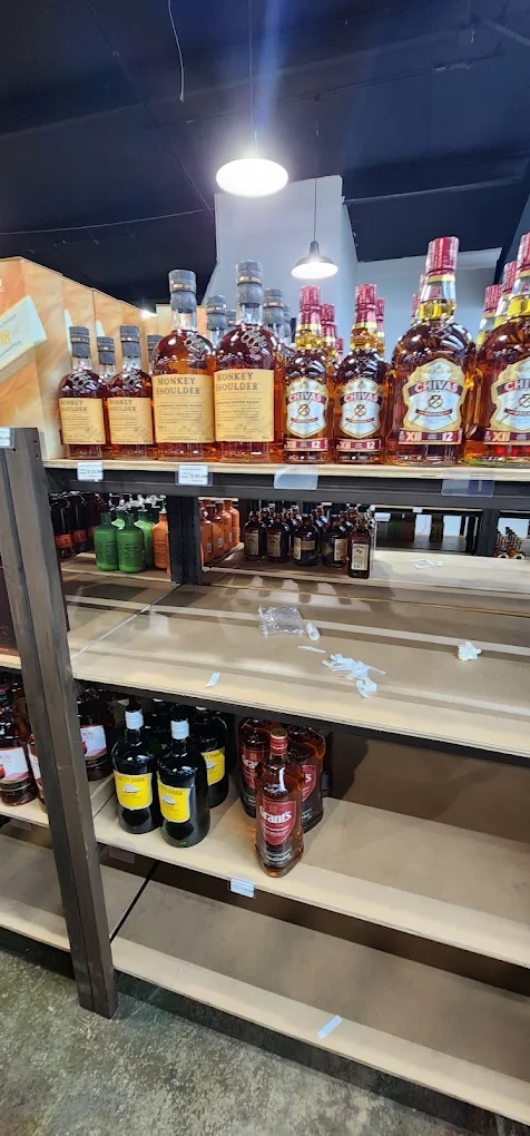 Whiskey shelf at Trenton Liquors, including Monkey Shoulder and Chivas Regal